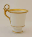 One of nine cups and six saucers from an Old Paris porcelain tableware set in white with gold t…