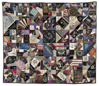 A colorful crazy quilt with numerous designs and motifs. 