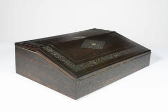 A rosewood portable desk with an inlaid mother-of-pearl border and diamond center motif on the …