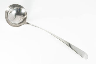 A silver punch ladle In the Old English pattern with an inscription on the handle end. 