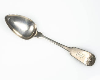 A silver teaspoon with a fiddle handle embossed with a basket of flowers. 