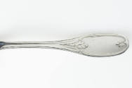 A close-up of the Olive pattern on the handle terminus.