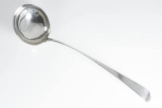 A silver punch ladle with an Old English handle. 