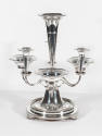 An eight-piece Victorian silver-plate epergne with a flower-shaped vase center support and mirr…