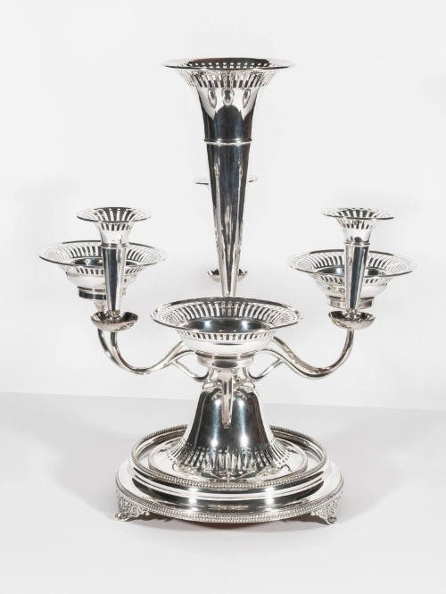 An eight-piece Victorian silver-plate epergne with a flower-shaped vase center support and mirr…