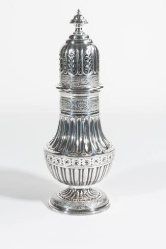 An English sugar caster with a removable pierced top over a paneled, fluted, and heavily engrav…