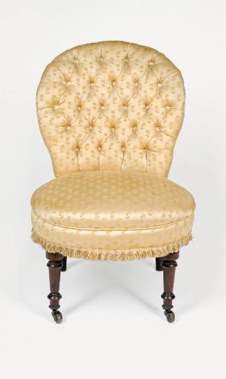 A Victorian side chair upholstered in gold brocade with a tufted back from three-piece suite co…