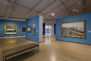 A view facing the north wall and entrance featuring French Impressionist paintings.