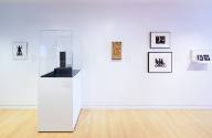 West wall display of permanent collection works.