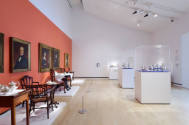 The east and south walls featuring four vignettes of tea services and vitrines with silver serv…