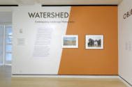Installation shot of the entrance and title wall for the exhibition Watershed: Contemporary Lan…