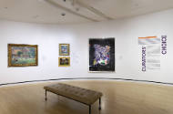 An installation shot of the northeast corner with the title panel on the right and four works t…