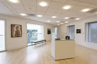 An installation shot of the northeast corner of the #art912 gallery with a vitrine in the cente…