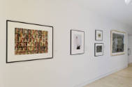 An installation shot of the east wall of the second-floor corridor with four two-dimensional wo…