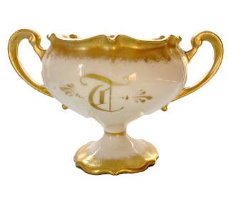 Double-handled porcelain sugar bowl with a hand-painted gilt monogram "T" and gilt trim.