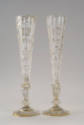 One of a pair of clear Bohemian glass vases, tall, slender in shape with an octagonal lip. The …