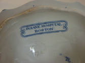 A detail of the inscription on the interior of the tureen lid, "INSANE HOSPITAL / BOSTON."