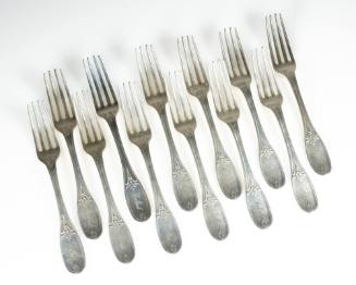 Twelve silver luncheon forks in the Olive pattern. 