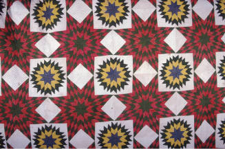 Pieced quilt in Lone Star and Carpenter’s Wheel patterns.