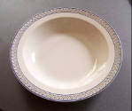 A soup bowl from a fifty-one-piece dinner service of Wedgwood Queen's ware in cream with a hand…