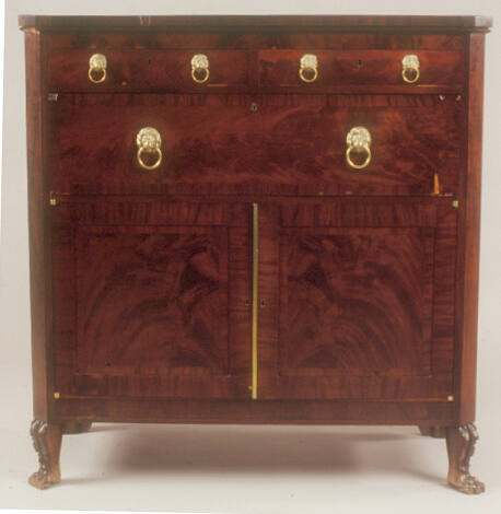 A Sheraton-style butler's desk with two small drawers at the top, a large central drawer and a …