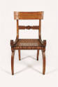 One of fifteen side chairs with a concave rectangular crest rail above a splat with a central m…