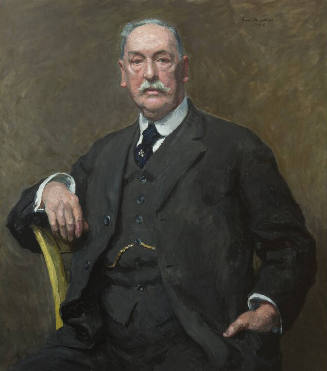 A quarter-length portrait of a white male with gray hair and mustache seated in a yellow chair …
