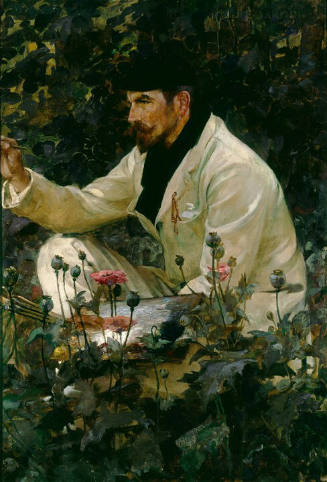 A man in a white suit sits amongst the foliage and flowers, holding a palette and brushes in th…