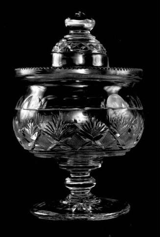 A cut-glass compote with a wide rim, circular body with fan and strawberry-diamond patterning, …