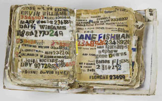 A recycled telephone book with a collage of newspaper, magazine, and cardboard cut-outs.