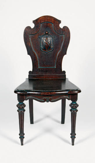 One of a pair of mahogany Gothic Revival style hall chairs with a carved monogram "M T,"  for M…