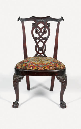 A chair with a decorative open back, upholstered seat and claw and ball feet on cabriole front …