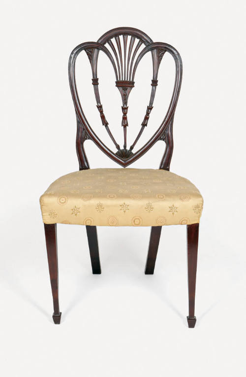 A mahogany side chair with a shield back (heart-shaped) in the American Hepplewhite-style with …