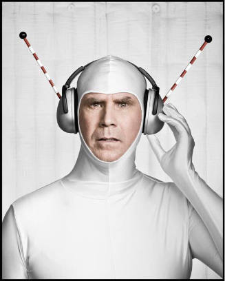 A color photograph of actor and comedian Will Ferrell dressed in a silver spandex body suit wit…