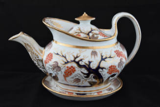 A teapot with a stand from a twenty-one-piece tea service characterized by a tree and its base …