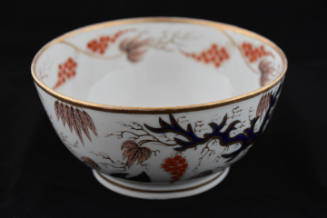 A waste bowl from a twenty-one-piece tea service characterized by a tree and its base leaves in…