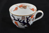 One of eight teacups from a twenty-one-piece tea service characterized by a tree and its base l…