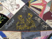 A detail of a patch with two women conversing. 