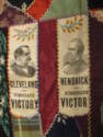 A detail of two patches featuring political figures.