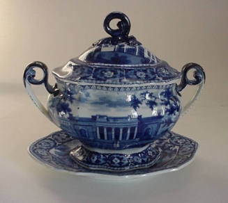 A blue and white transfer-printed stoneware sauce tureen and stand featuring an image of the Br…
