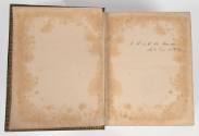 An image of the interior front cover and first page inscribed with "J.G. & M.W. Thomas / Savh D…