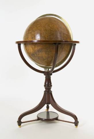 A mahogany tripod stand with circular support for a celestial globe created out of boxwood and …